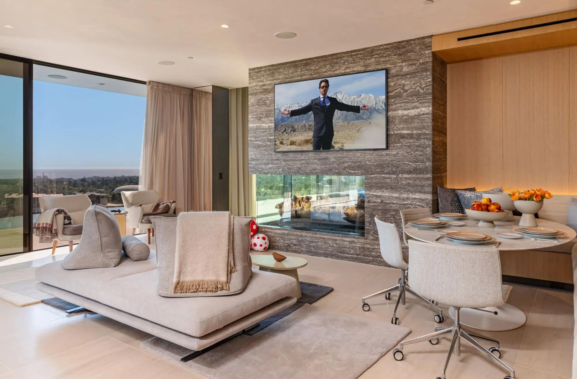 The Getty House — 684Firth Brentwood CA LA Great Room Stone Fireplace Breakfast Nook Sliding Glass Doors Indoor Outdoor  Modern 