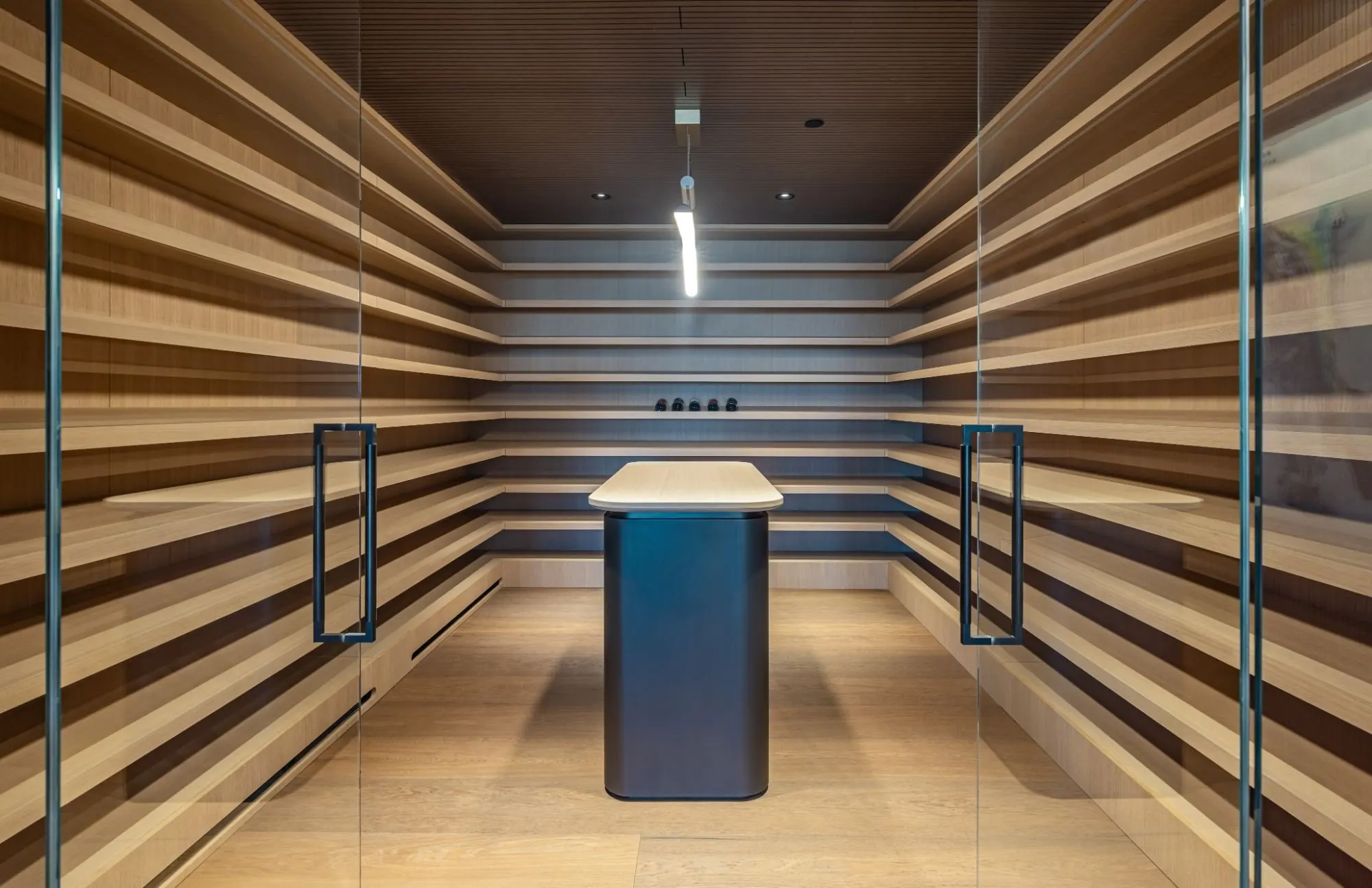 The Getty House — 684Firth Brentwood CA LA Wine Cellar Horizontal Wood Shelving Glass Doors Modern Tasting Table  Modern Home