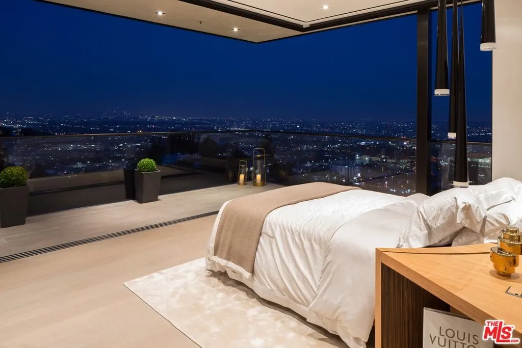 Thrasher Ave — bedroom opening to the terrace with nighttime city views