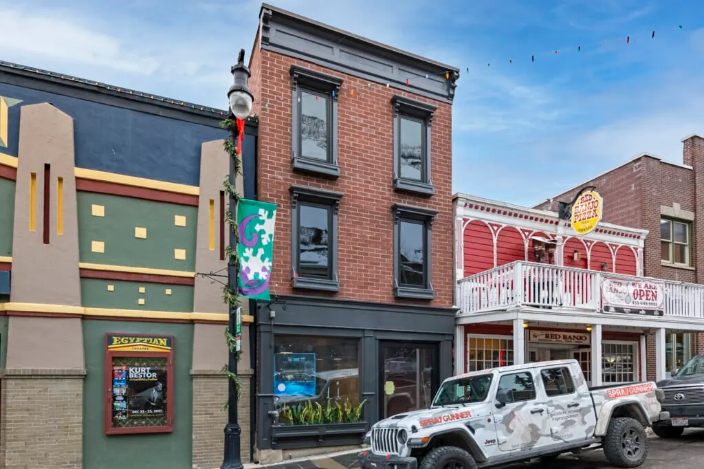 Main Street — the renovated brick building in its historic streetscape beside the Egyptian Theatre