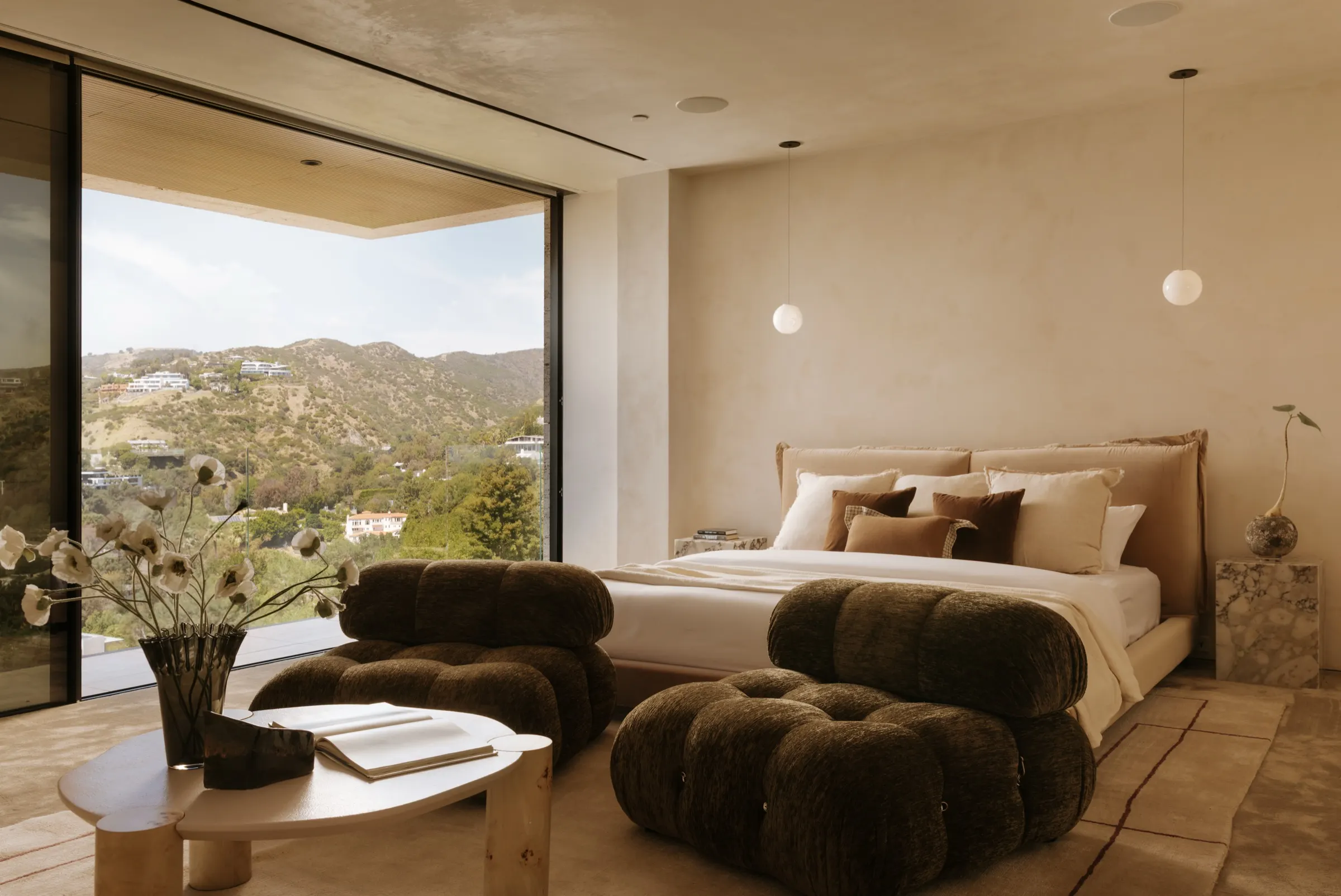 The Getty House, Brentwood — bedroom with canyon view and boucle seating