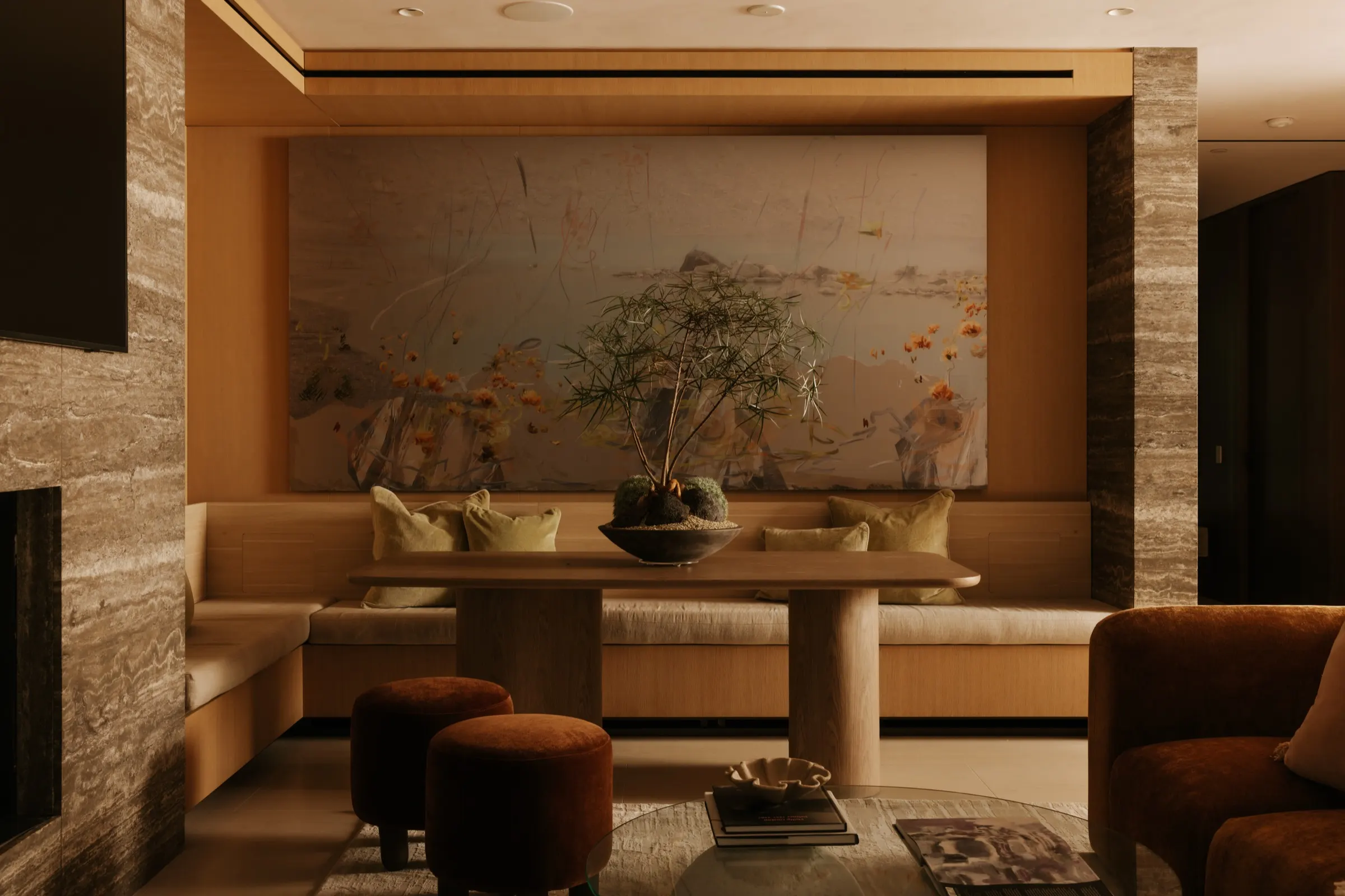 The Getty House, Brentwood — breakfast banquette between travertine walls