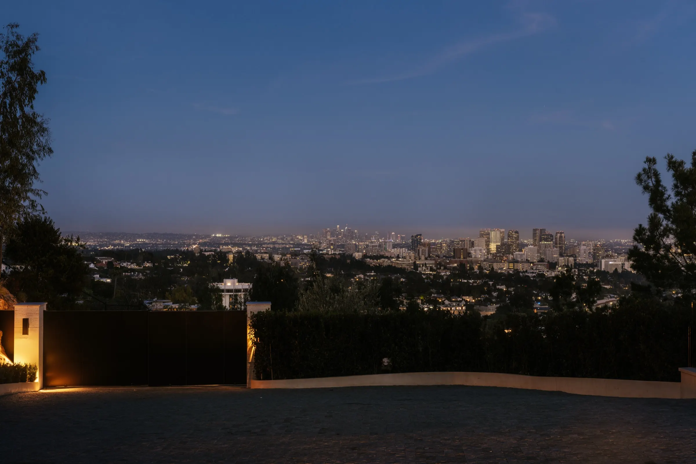 The Getty House, Brentwood — city lights at dusk from the motor court