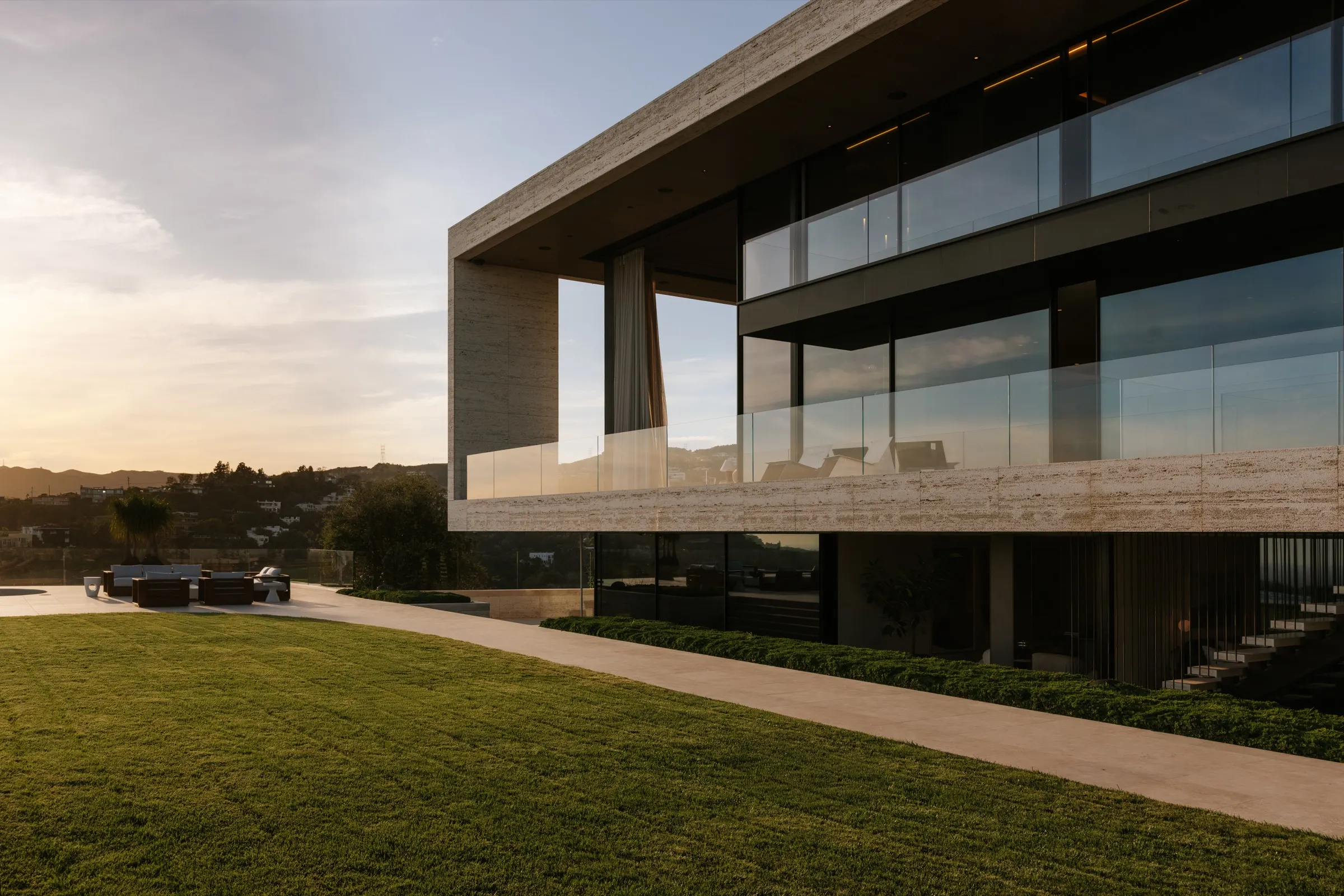 The Getty House, Brentwood — rear elevation and lawn at golden hour