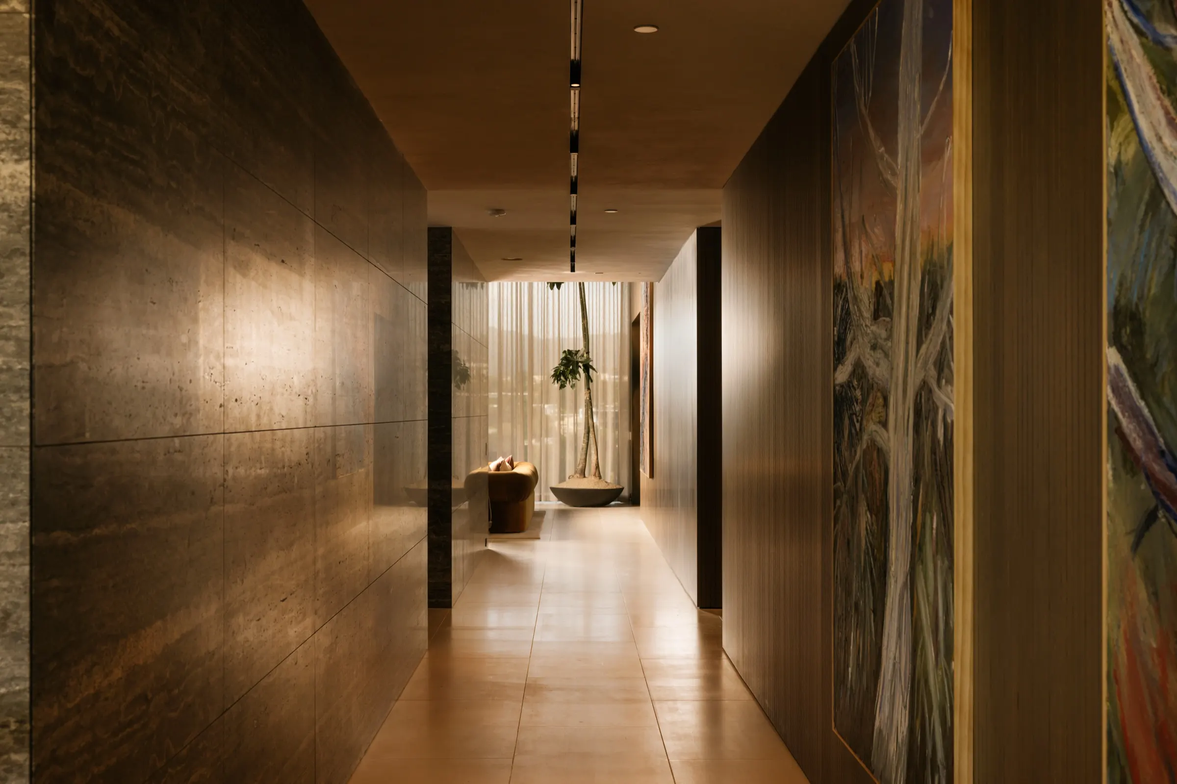 The Getty House, Brentwood — gallery hallway in bronze paneling