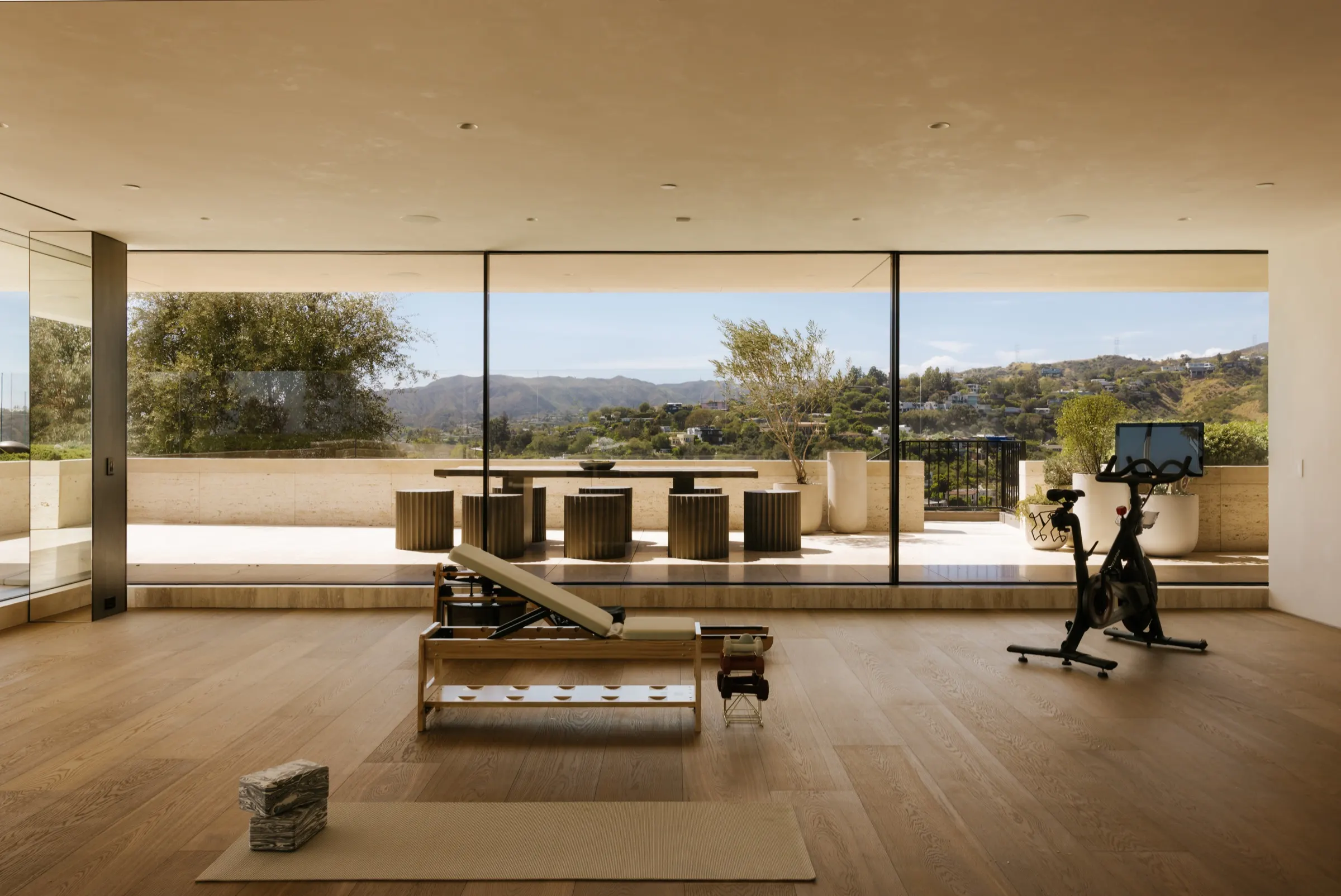 The Getty House, Brentwood — gym with a glass wall to the hills