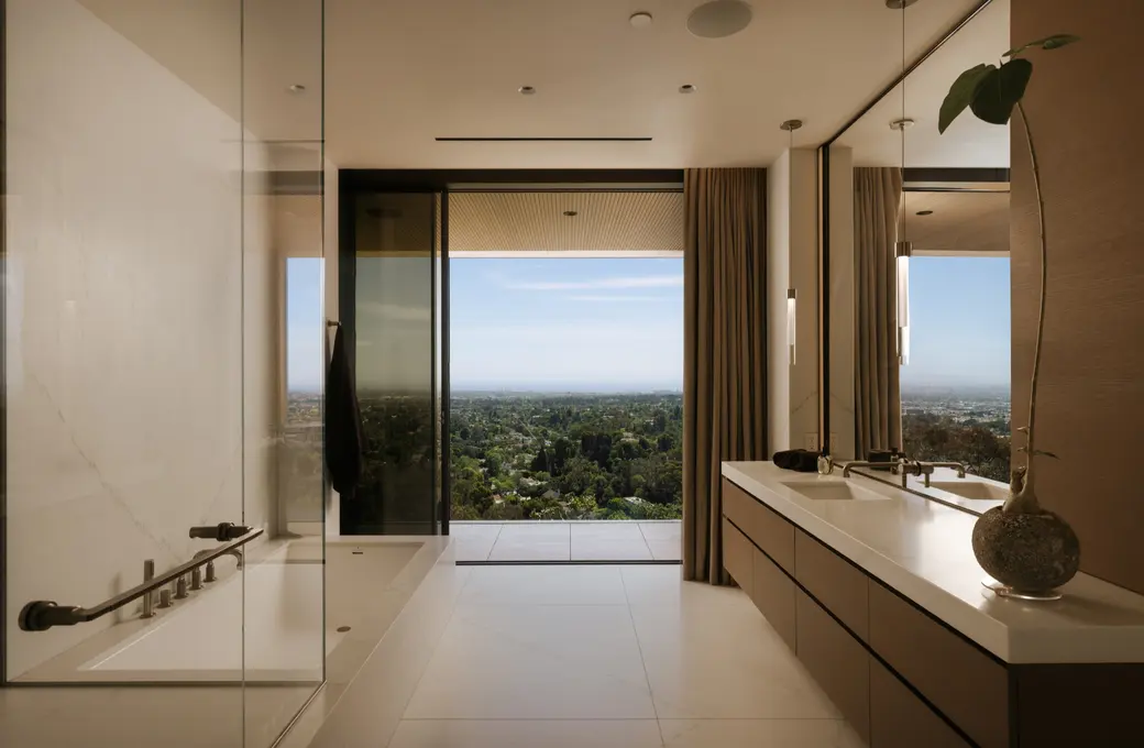 The Getty House primary bath with floating vanity and the view beyond