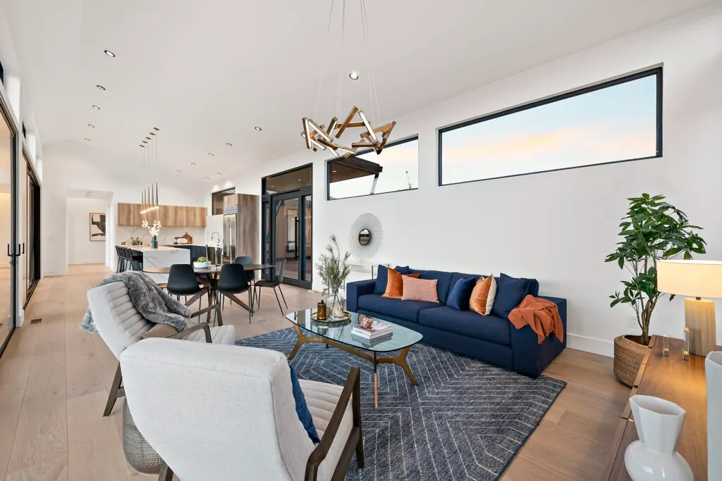 Icon Haus — Icon House Benloch Heber City Living Room Open Concept Navy Sofa Artistic Chandelier Kitchen View  Modern Cust