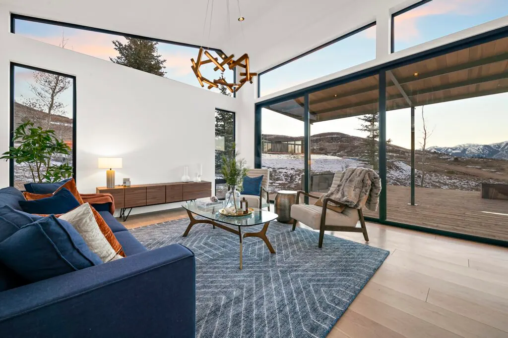 Icon Haus — Icon House Benloch Heber City Living Room Vaulted Ceiling Sliding Doors Geometric Rug Mid Century Credenza  Mo