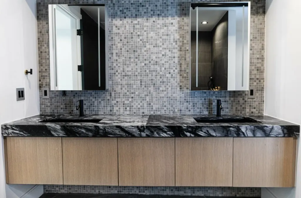 Main Street — double vanity in black marble with mosaic tile wall