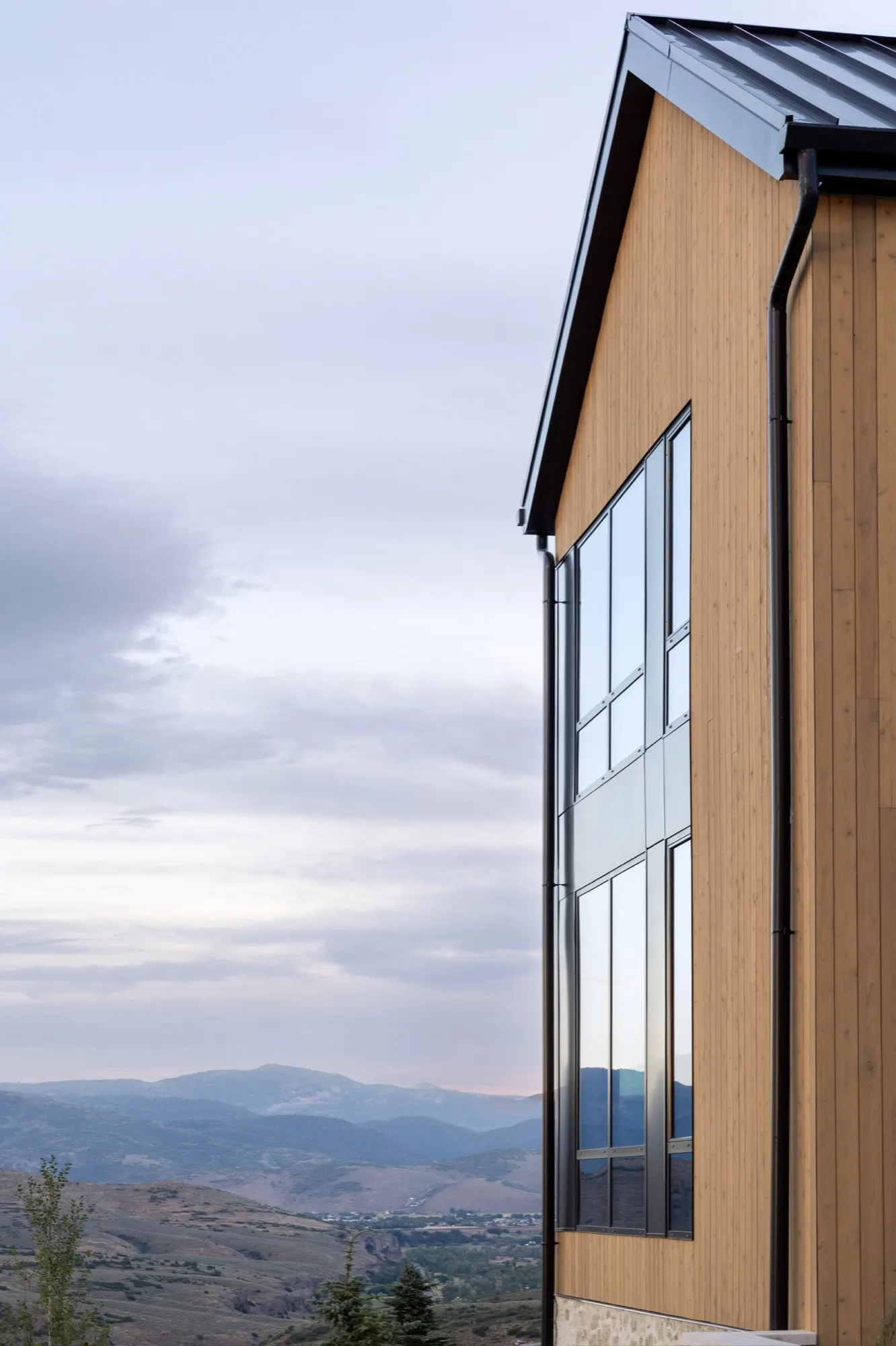 Lumen — gable window with the Jordanelle valley beyond