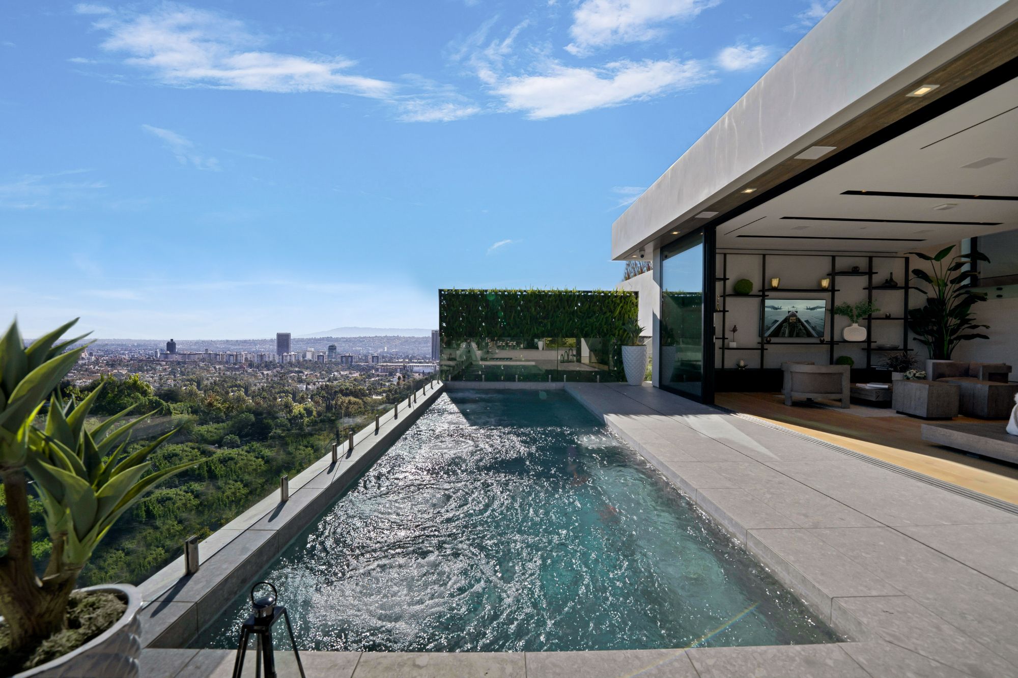 Flicker Estate — the infinity pool by day over the Hollywood Hills
