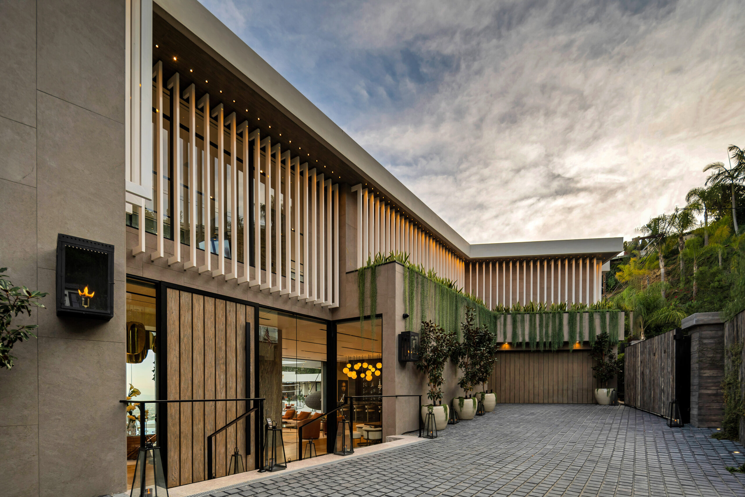 Flicker Estate — motor court and louvered façade by day