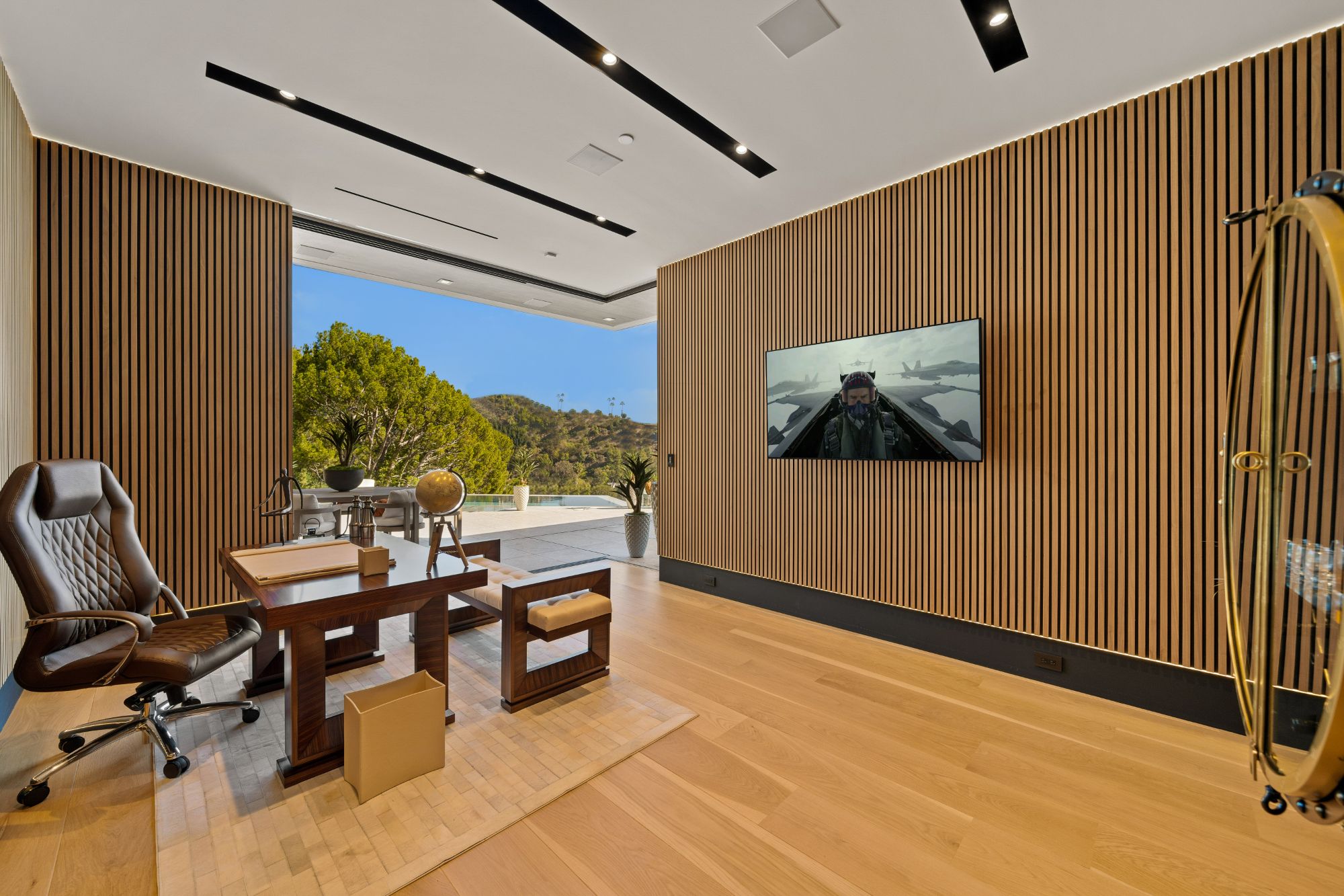 Flicker Estate — command-center office with slatted wood wall