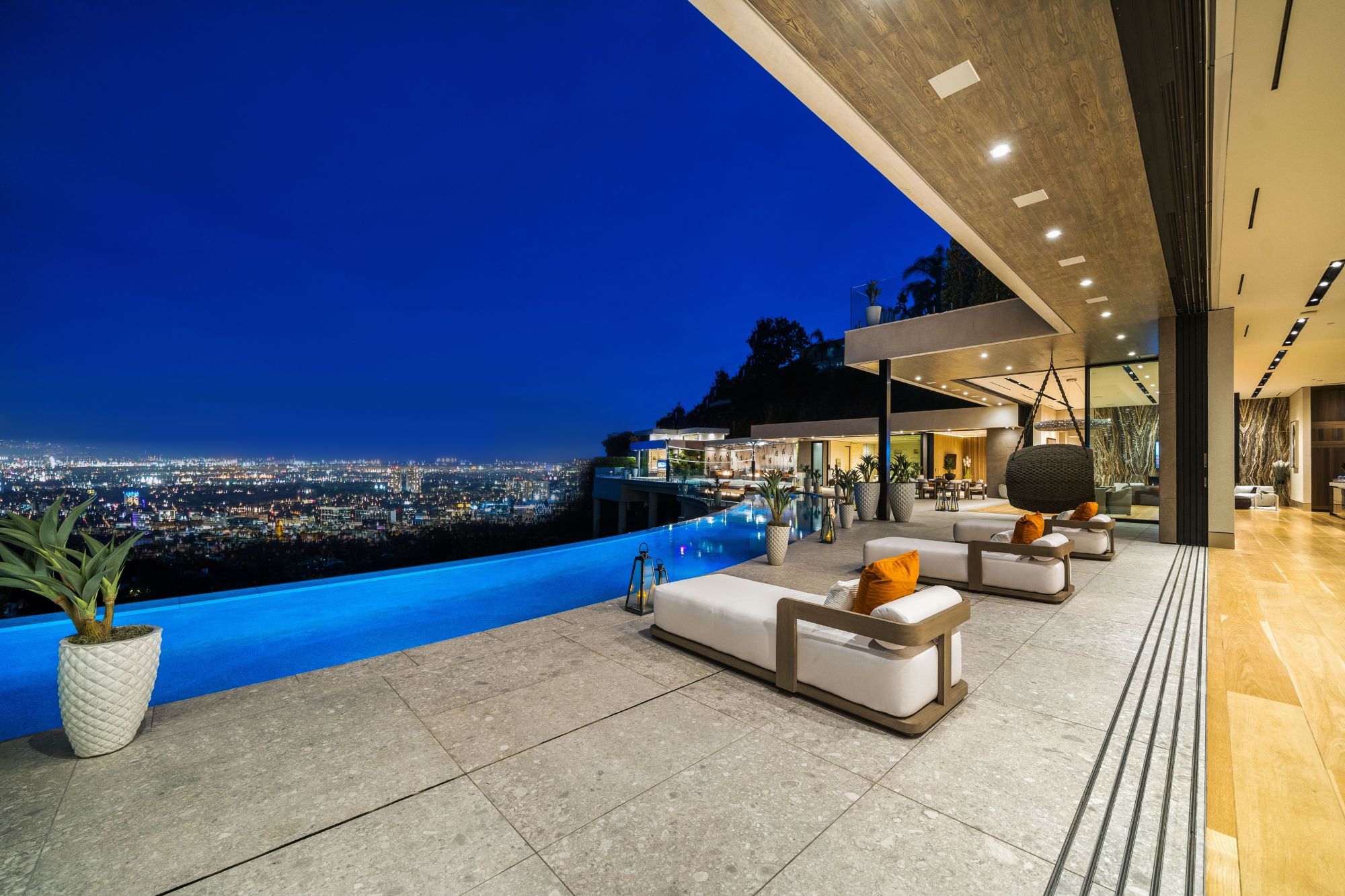 Flicker Estate — pool terrace at night over the Los Angeles skyline