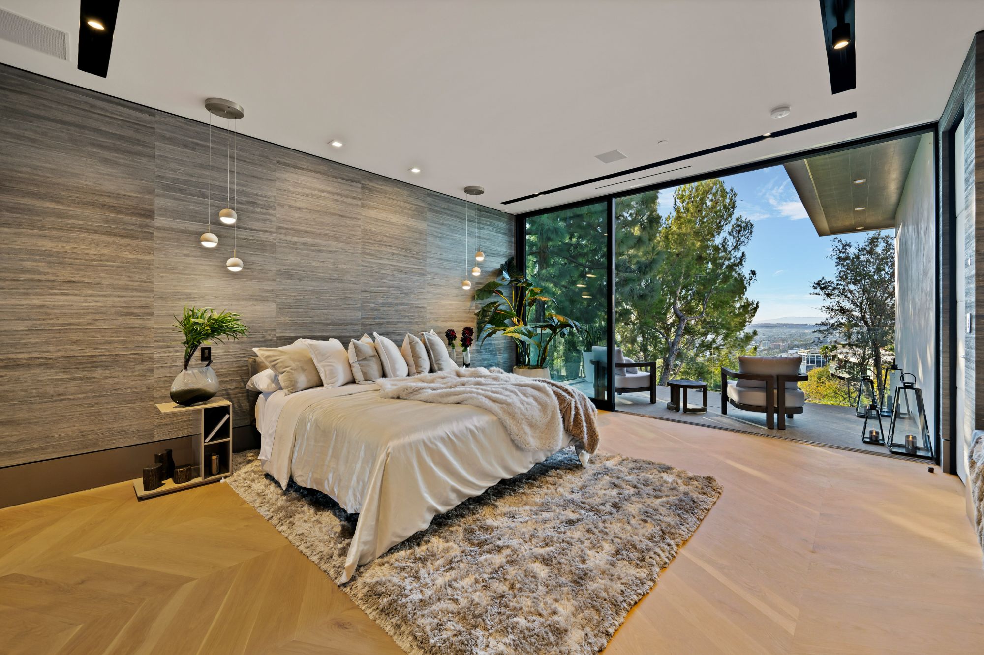 Flicker Estate — primary bedroom open to the 1,500-square-foot balcony