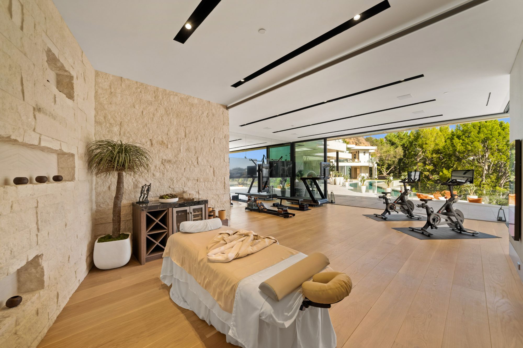 Flicker Estate — spa massage room against the stone wall