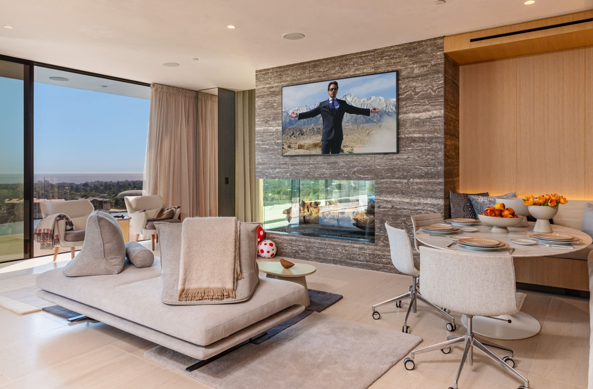 The Getty House — 684Firth Brentwood CA LA Great Room Stone Fireplace Breakfast Nook Sliding Glass Doors Indoor Outdoor  Modern 