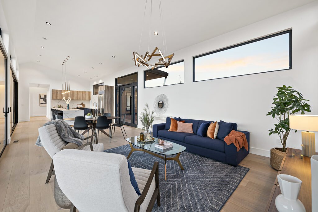 Icon Haus — Icon House Benloch Heber City Living Room Open Concept Navy Sofa Artistic Chandelier Kitchen View  Modern Cust