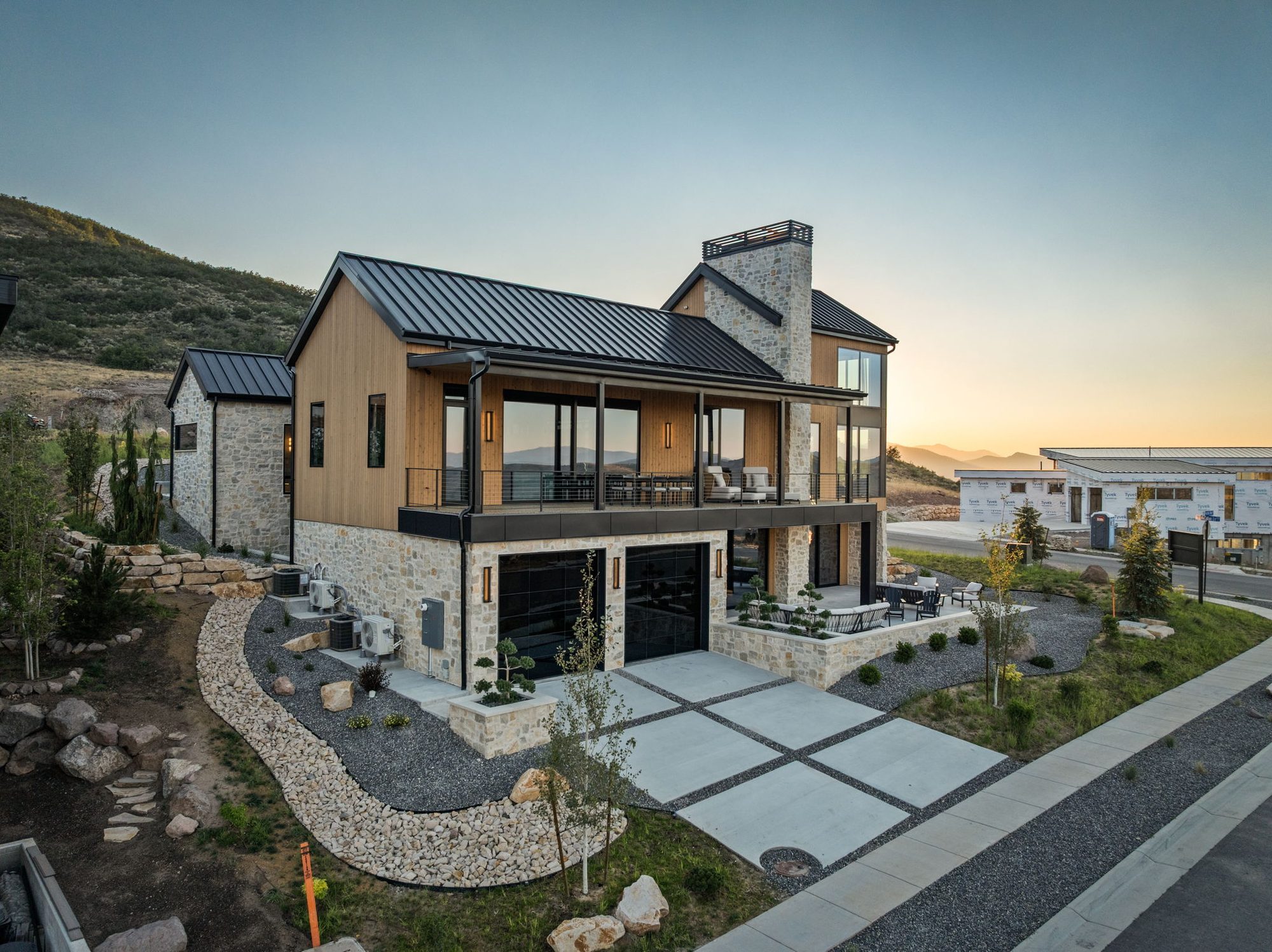 Lumen — aerial of the rear elevation with the Jordanelle reservoir beyond