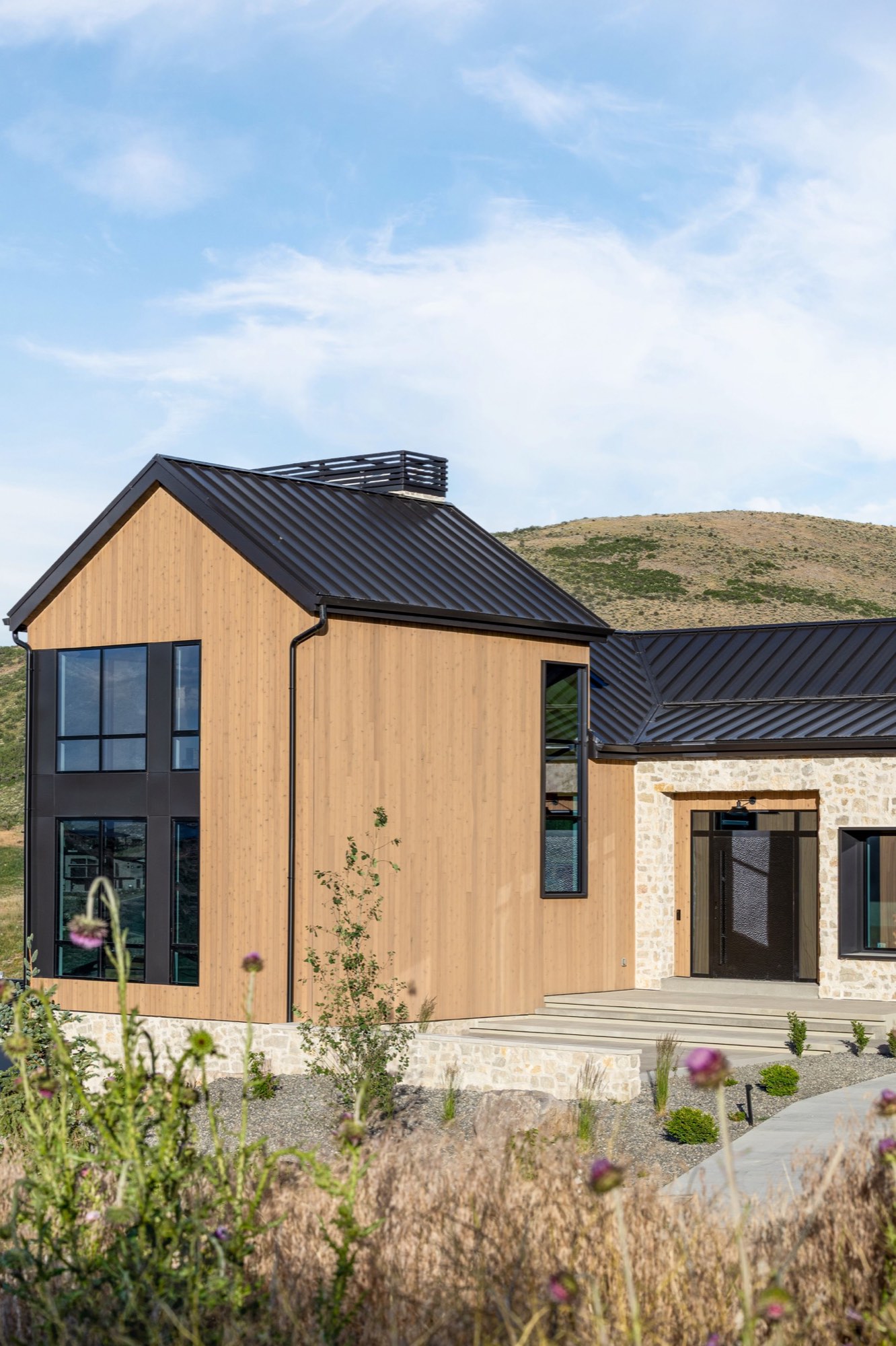 Lumen — front corner, cedar gable and entry in afternoon light