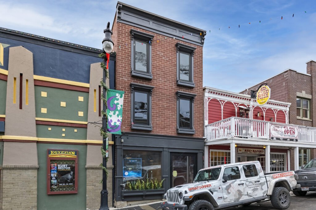 Main Street — the renovated brick building in its historic streetscape beside the Egyptian Theatre