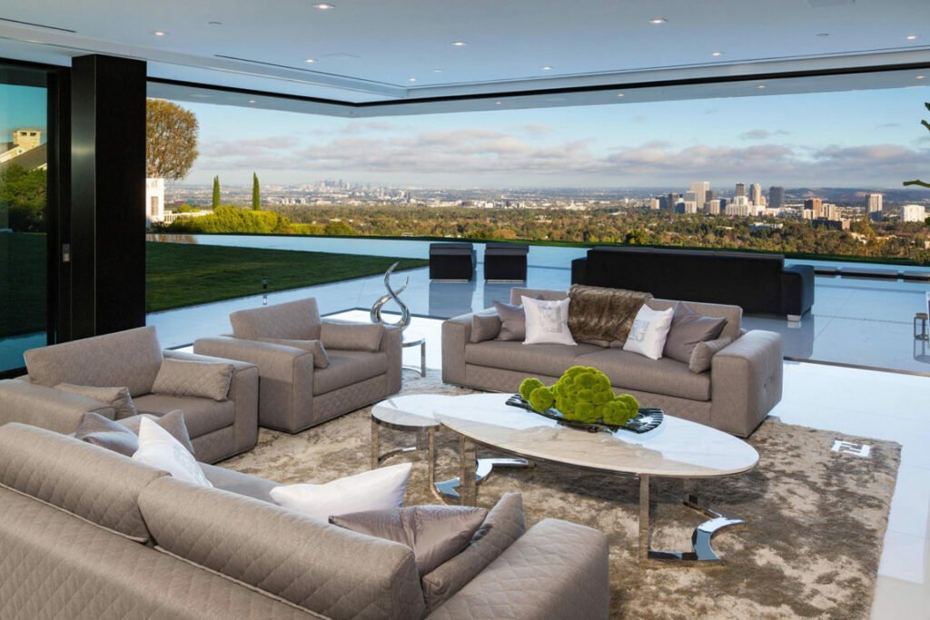 Stradella — living space with floor-to-ceiling glass and city-to-ocean views