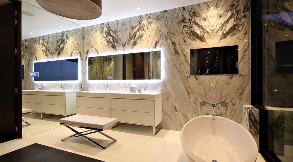 Stradella — marble primary bathroom, Bel Air estate by Roderick Builders