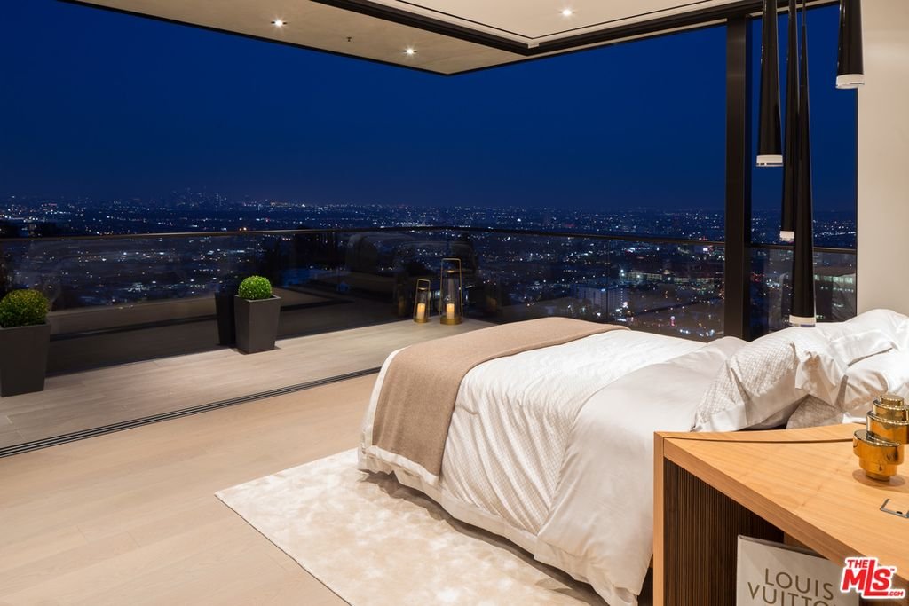 Thrasher Ave — bedroom opening to the terrace with nighttime city views