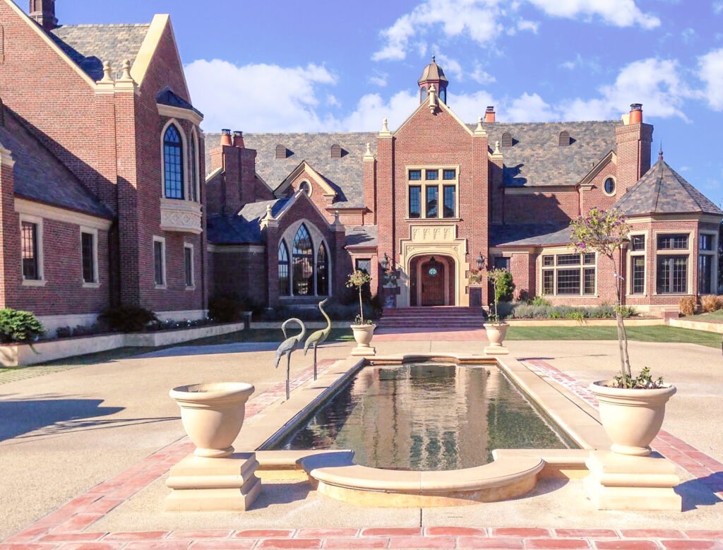 White Stallion — covered brick front entry of the English Tudor estate